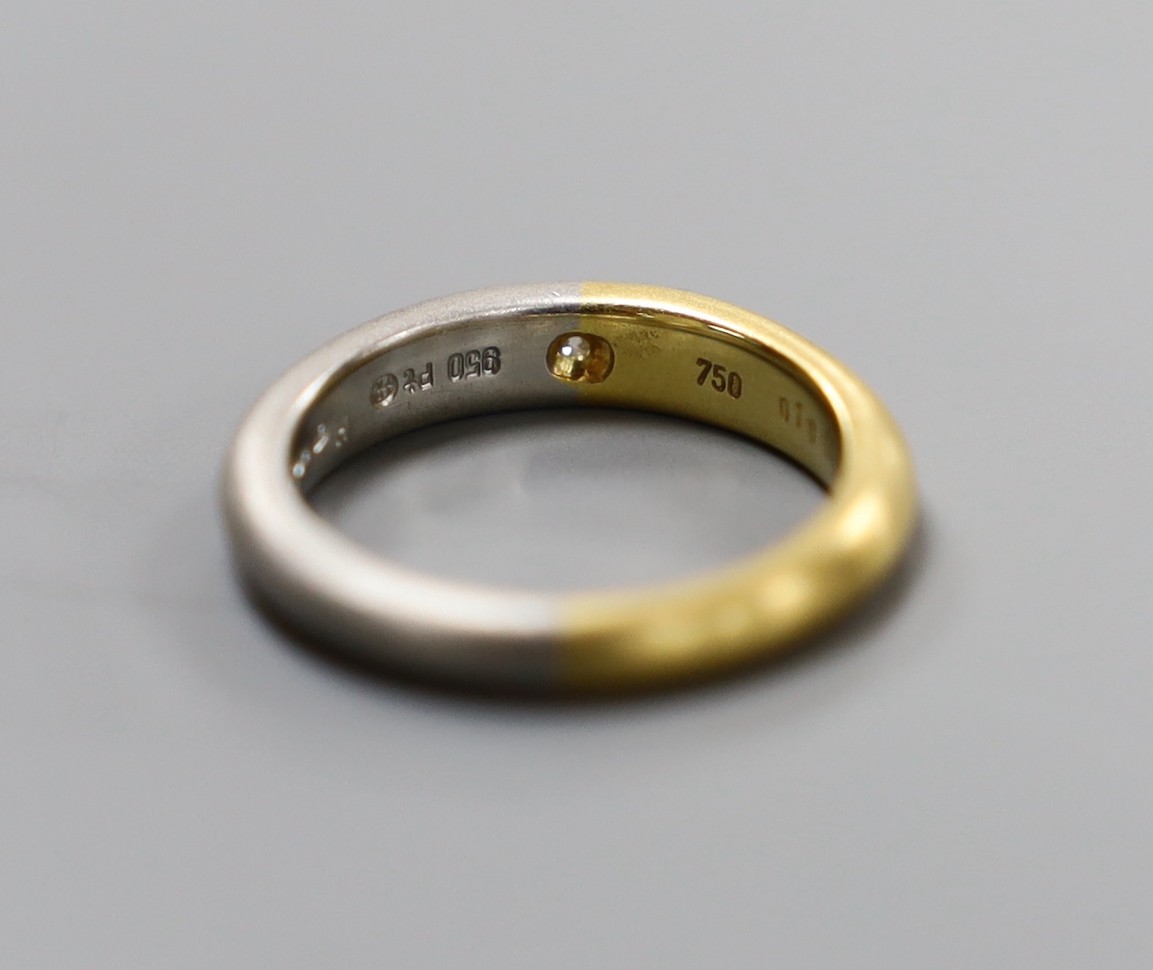 A modern sandblasted plat and 750 yellow metal ring, with gypsy set diamond, size M, gross weight 7.1 grams